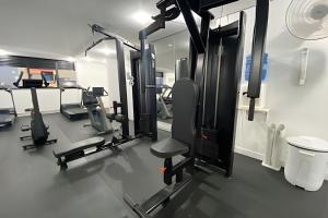 a gym with several treadmills and tread machines at SHB - The Jewel Pitangueiras with complete leisure in Guarujá