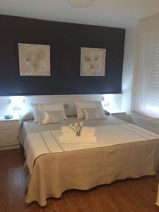 Postel nebo postele na pokoji v ubytování Hotel Herreros