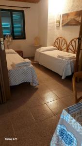 Postel nebo postele na pokoji v ubytování casa fronte mare puro relax
