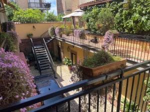 a balcony with a bunch of plants and flowers at Hotel Amadeus in Caserta
