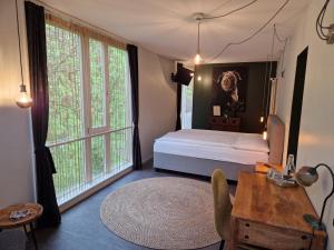 Postel nebo postele na pokoji v ubytování Hotel Landhaus