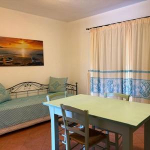 Ένα ή περισσότερα κρεβάτια σε δωμάτιο στο Marinella Residence