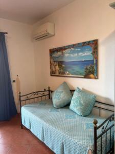 Ένα ή περισσότερα κρεβάτια σε δωμάτιο στο Marinella Residence