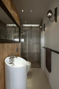 a bathroom with a white sink and a shower at Pasterska Chata in Kluszkowce +64 photos
