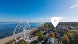 an aerial view of a city with a ferris wheel at MEERverliebt in Kühlungsborn