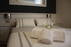 Postel nebo postele na pokoji v ubytování Hotel Herreros