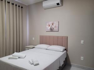 Postel nebo postele na pokoji v ubytování Flats Ipê