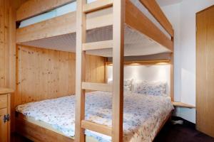 a bunk bed in a bedroom with a bunk bed in a room at Ferienwohnung Huttenberg in Reit im Winkl