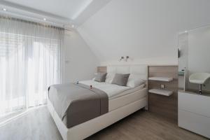Postel nebo postele na pokoji v ubytování Residence Malva