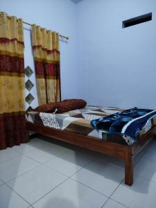 Postel nebo postele na pokoji v ubytování Bromo Jay House Homestay + 6 fotografií