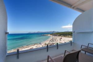 a balcony with a view of the beach and ocean at Globales Concord in Can Picafort