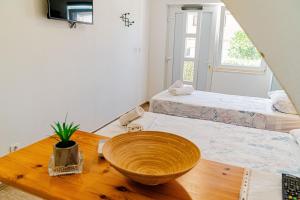Rooms & Apartments Mirakul客房内的一张或多张床位