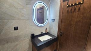 a bathroom with a sink and a mirror at Durmitor Summit in Žabljak +52 photos