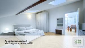 Postel nebo postele na pokoji v ubytování Conte Durini Apartments & Rooms