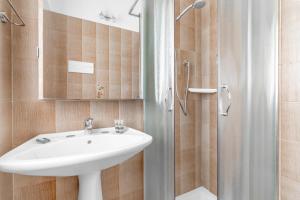 a bathroom with a sink and a shower at Villa Imperiale - Private Pool & Relax in Desenzano del Garda