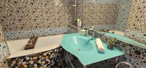 a bathroom with a sink and a bath tub at La Dolce Vita in Braşov +96 photos