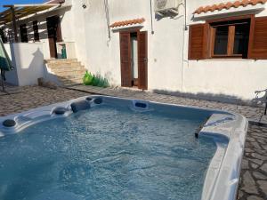 een zwembad voor een huis bij Villa Corvetta in Ostuni