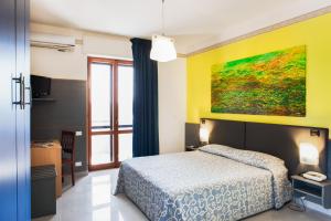 Postel nebo postele na pokoji v ubytování Hotel Côte D'Est