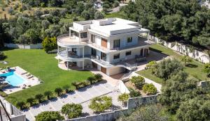 an aerial view of a house with a swimming pool at Luxury Villa Amaltheia Rhodes in Koskinou