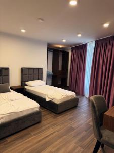 Postel nebo postele na pokoji v ubytování Andor Luxury Hotel & Duplex