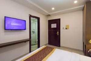 TV a/nebo společenská místnost v ubytování Apollo Airport Hotel
