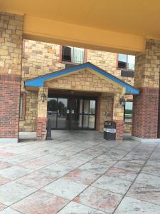 a front entrance to a brick building at Studio 7 Harker Heights in Harker Heights