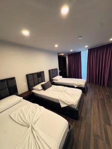 Postel nebo postele na pokoji v ubytování Andor Luxury Hotel & Duplex