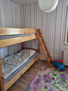 Ένα ή περισσότερα κρεβάτια σε δωμάτιο στο Ferienhaus Hochwald