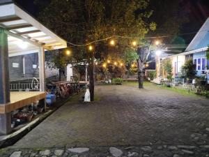 an empty street at night with lights on at Bromo Jay House Homestay I in Sukapura