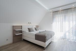 Postel nebo postele na pokoji v ubytování Residence Malva