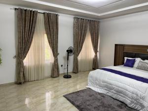 Postel nebo postele na pokoji v ubytování Global Premium Apartments
