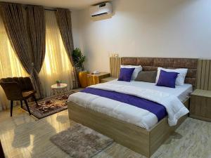 Postel nebo postele na pokoji v ubytování Global Premium Apartments