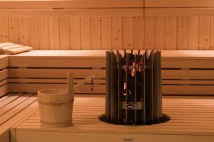 a heater in a sauna with a cup next to it at NAU Palacio do Governador in Lisbon