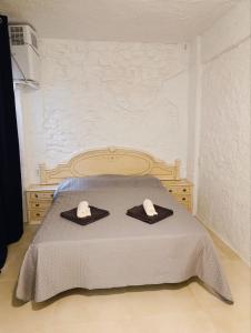 Ένα ή περισσότερα κρεβάτια σε δωμάτιο στο La Cueva Encantada