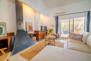 a living room with a couch and a fireplace at RostoIl Espai de Calma in Muro