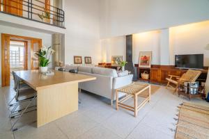 a living room with a couch and a table at RostoIl Espai de Calma in Muro +22 photos