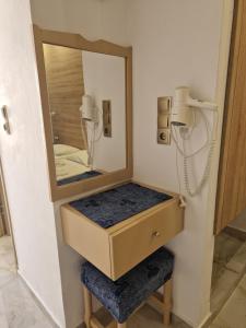 a bathroom with a sink and a mirror at Christina Studios in Kefalos +62 photos