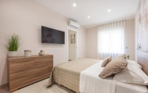 Ένα ή περισσότερα κρεβάτια σε δωμάτιο στο Lucky House Sorrento +8 φωτογραφίες