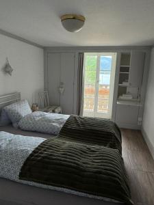 A bed or beds in a room at Double Room with view