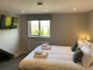 Ένα ή περισσότερα κρεβάτια σε δωμάτιο στο Jasmine Cottage