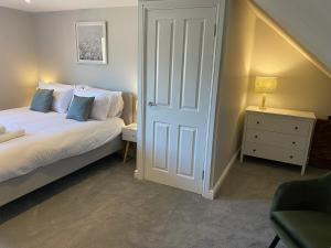 Ένα ή περισσότερα κρεβάτια σε δωμάτιο στο Jasmine Cottage