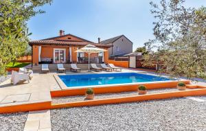 a swimming pool in the backyard of a house at Amazing Home In Pula With Kitchen in Pula +41 photos