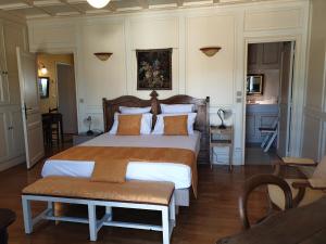 Ένα ή περισσότερα κρεβάτια σε δωμάτιο στο Chez Danièle - Maison au cœur du village de Lalbenque