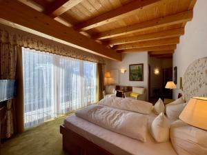 Postel nebo postele na pokoji v ubytování Hotel Garni Zerzer