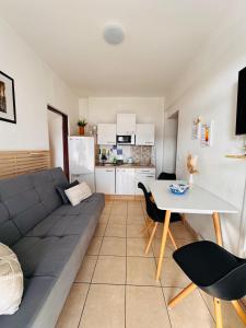 a living room with a couch and a table at Apartments Antonio in Pag