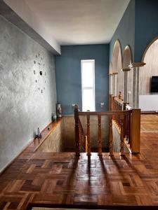 a room with a staircase and a blue wall at Boria House in Sevan