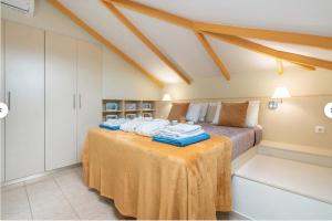 Postel nebo postele na pokoji v ubytování A&B Ialysos villas and apartments + 68 fotografií