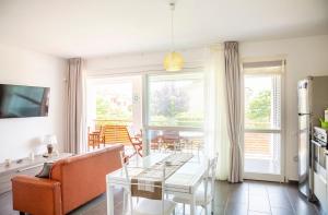 a living room with a couch and a table at Lovely Tiresia Apartment in Sperlonga