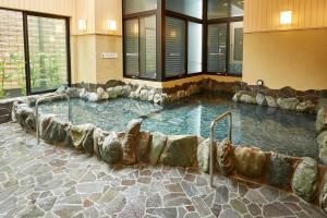 a large pool of water in a building at Home Story in Tokyo Ueno&Uguisudani-小島ビル&東京屋語 in Tokyo
