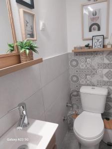 a bathroom with a white toilet and a sink at ΦΙΛΟΞΕΝΙΑ-Filoxenia in Veria +11 photos